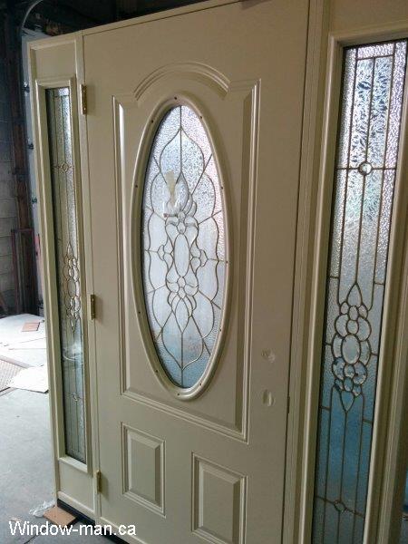 Front door installation. Single entry steel insulated white. Two sidelights. Cream beige color. Oval Peterborough stained glass collection